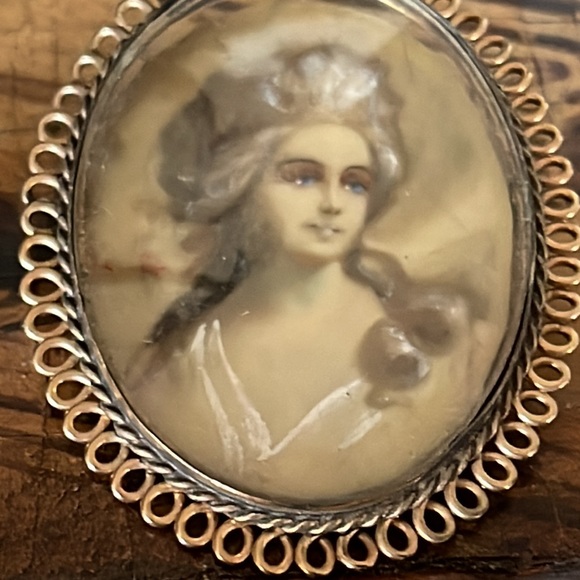 Victorian lady painted on ivory in muted colors wisps of...